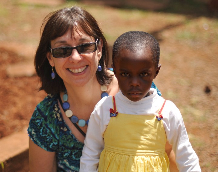 Deb with a child at the Children's Home