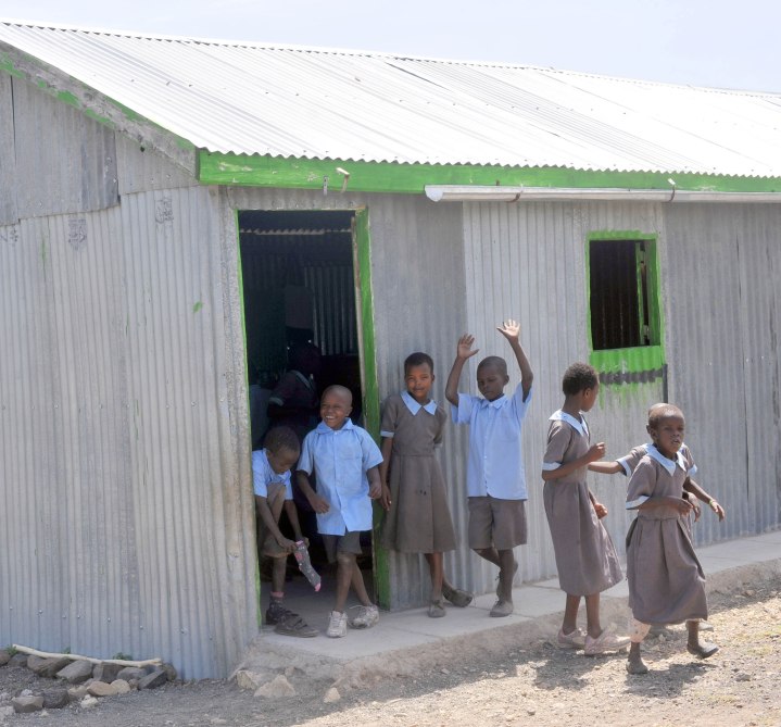 Maasai Children waving as we arrive