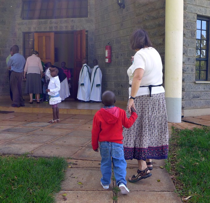 Lloydie with a child from Nyumbani Children's Home headed to church