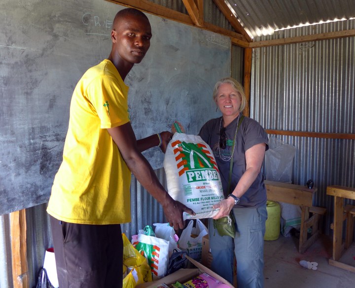 Karen and one of the PCDA teachers with a bag of maize for porridge