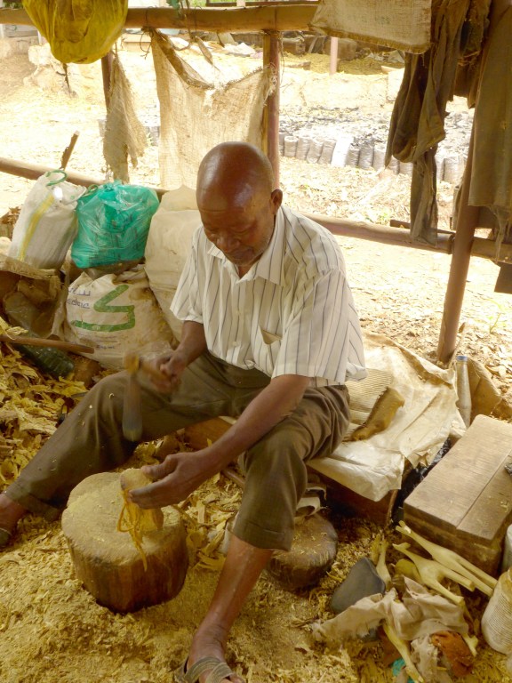 One of the carvers working on a giraffe