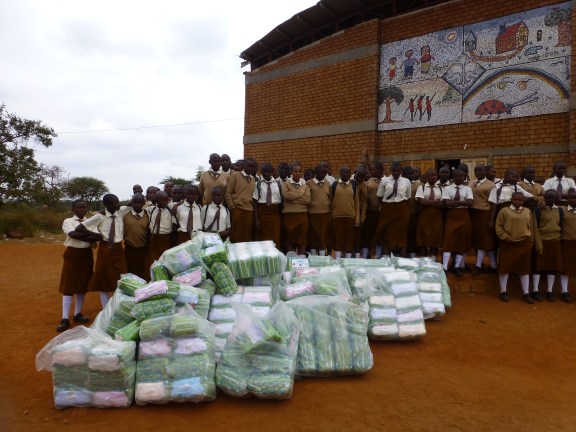 Delivering supplies to adolescent girls at Nyumbani Village