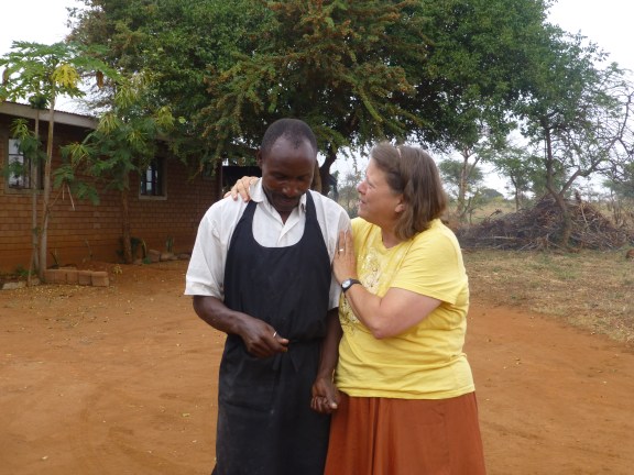 Lloydie sweet talking john, the Village cook and best mandazi maker