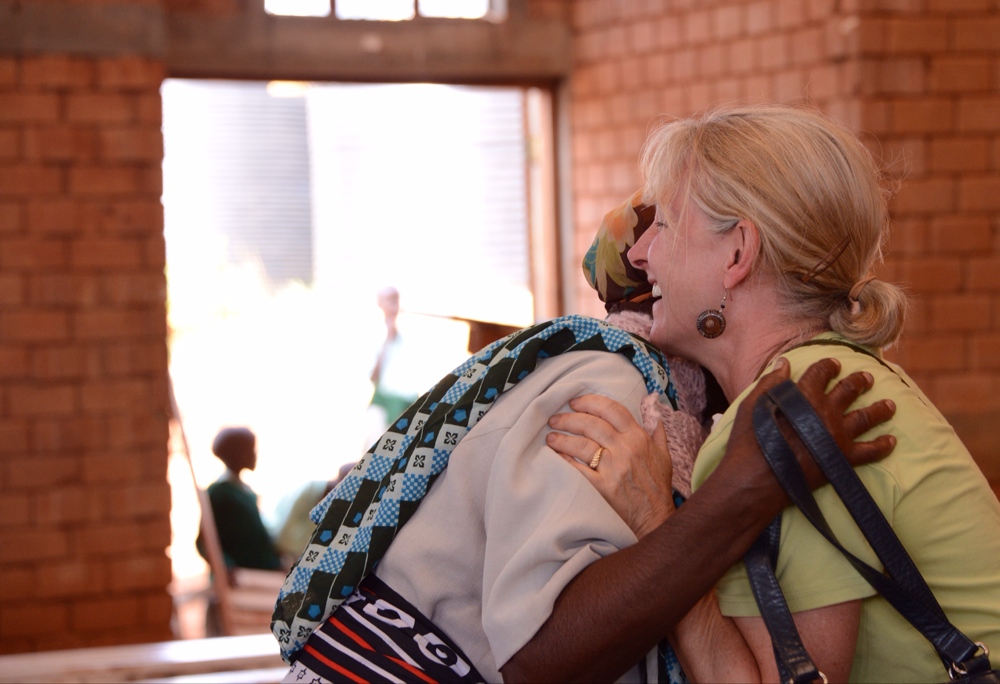 Hugging a scarf recipient